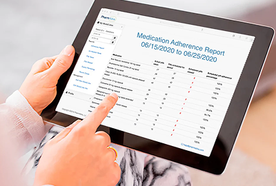 Person's hands pointing at a tablet showing a Medication Adherence Report table, listing medications, doses, and adherence rates.